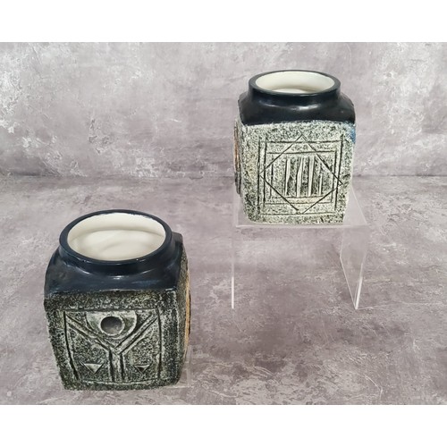 121 - A pair of Troika Pottery marmalade pots decorated by Linda Hazel with incised and painted abstract d... 