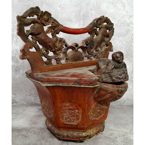 79 - An unusual cinnabar lacquered Chinese rice basket, with Dog Of Fo and blossoming carved carrying han... 