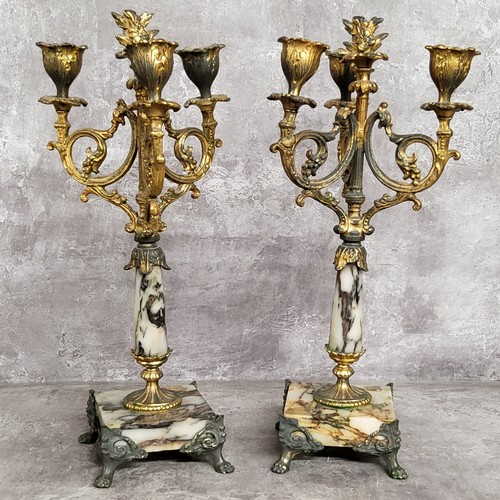 93 - A pair of 19th century French gilt metal mounted marble three branch candlestick garnitures c.1860, ... 