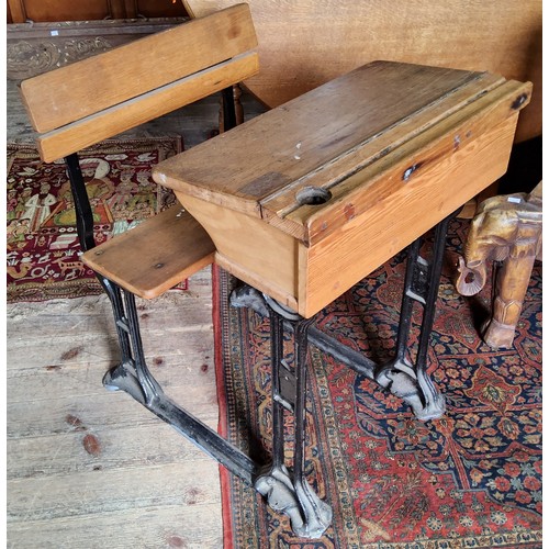 118A - An early 20th century child's school desk, wrought iron base