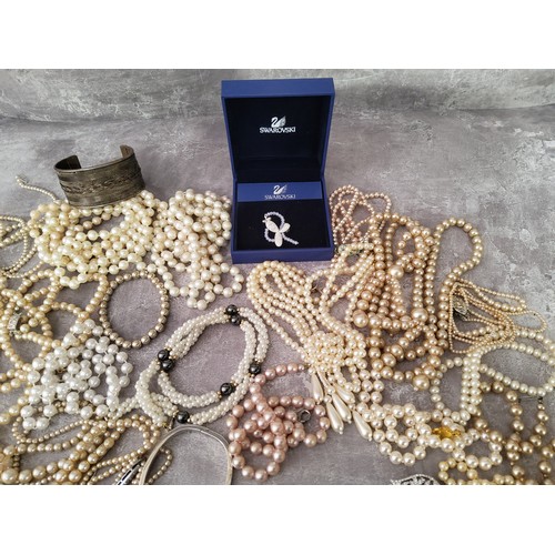 118 - A box of natural pearl necklaces; faux pearl necklaces; Swarovski jewellery; and other jewellery