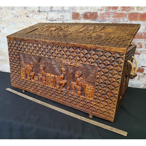 133 - Tribal - Large hand carved chest with hinged lid, carvings to top and all sidesHeight 42.5cm x width... 