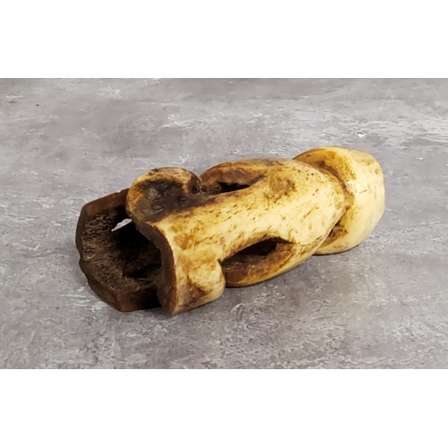 148 - AMENDED DESCRIPTION: an African leg bone carving, 11cm