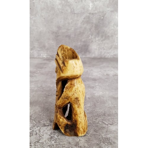 148 - AMENDED DESCRIPTION: an African leg bone carving, 11cm