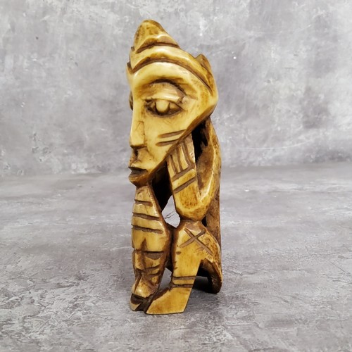 148 - AMENDED DESCRIPTION: an African leg bone carving, 11cm