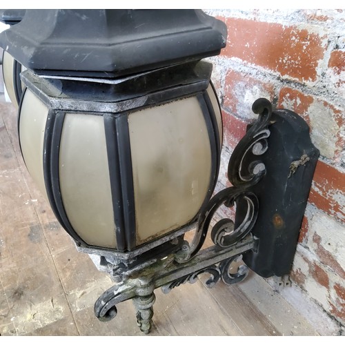 166 - A pair of country house entrance lanterns, wall mounted in the Victorian taste, 65cm high x 30cm dee... 