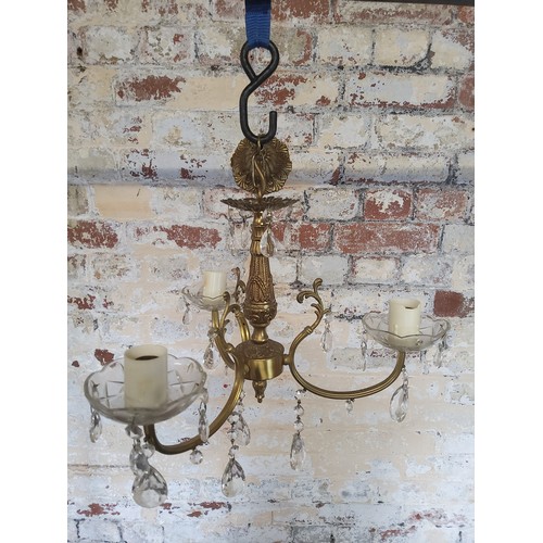 171 - A 3-branch crystal drop and brass chandelierHeight 40cm x dia 40cm