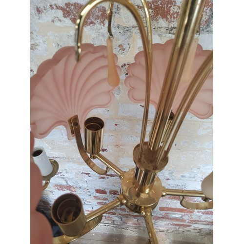 176 - A five-branch chandelier with pink clam shell glass shades; another 3-branch brass chandelierBrass c... 