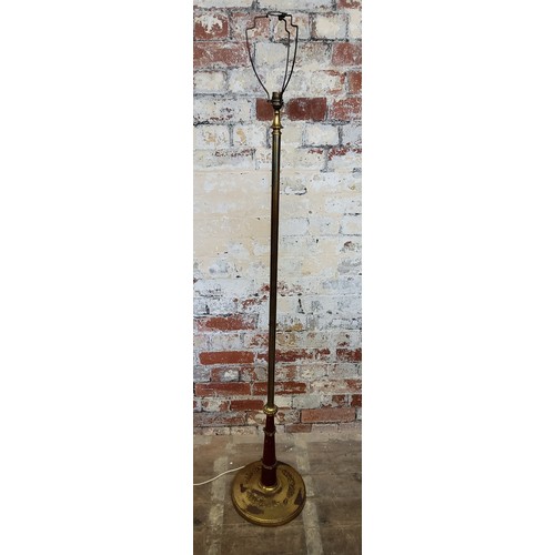 179 - An early 20th century toleware and gilt metal mounted standard lamp, weighted base, with shade 155cm... 