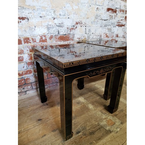 187 - A pair of 20th century black lacquered hand painted Japanese occasional tables, decorated with flowe... 