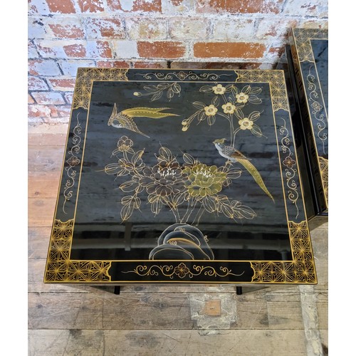 187 - A pair of 20th century black lacquered hand painted Japanese occasional tables, decorated with flowe... 