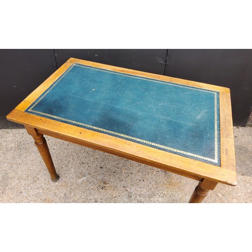 205 - An Edwardian oak teal tooled leather inlaid deskH73cm x W115cm x D68cm