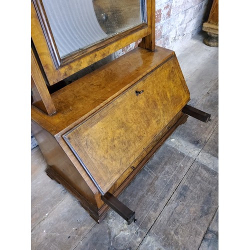 208 - A George II feather banded burr walnut dressing table mirror, fall front housing six drawers He... 