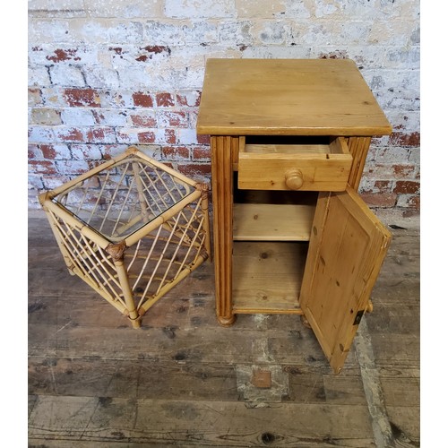 227 - A farmhouse pine bedside cabinet with drawer above  cupboard, raised on bun feet; square bamboo... 