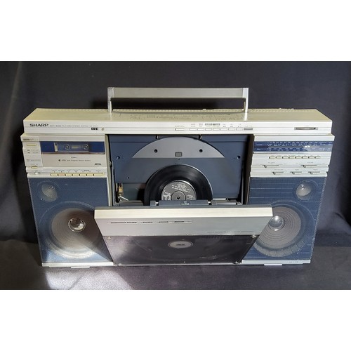 95A - Retro Ghetto blaster Sharp VZ 2500E, tape/vinyl/radio player (powers up)Height 40cm x width 70cm x d... 