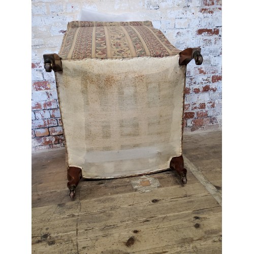 244 - A late Victorian armchair re- upholstered in chintz striped fabric, raised on mahogany cabriole legs... 