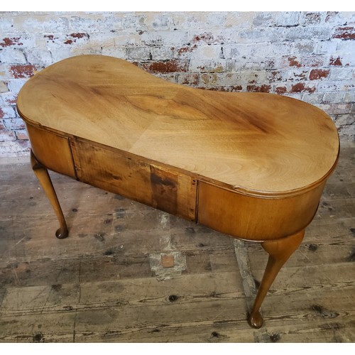 245 - A small kidney shaped dressing table with one long flanked by two short drawersheight 74.5cm x width... 