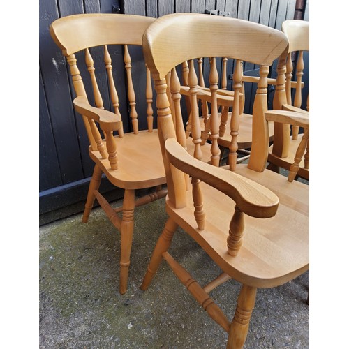 241 - Four classic farmhouse pine carver dining chairsHeight 93.5 cm (seat 47cm) x width 55.5 x depth 44.5... 