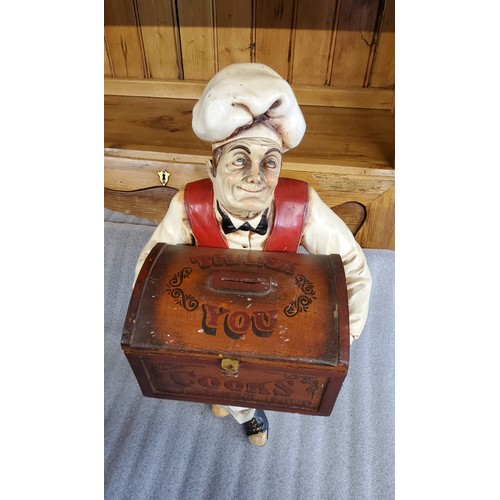 61A - Counter top vintage tip box, styled as chef seated on stool holding a tip box, with words  