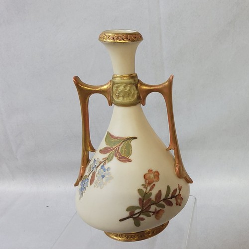 3 - A Royal Worcester two handled ovoid vase, printed and painted with flowers on a blush ivory ground, ... 