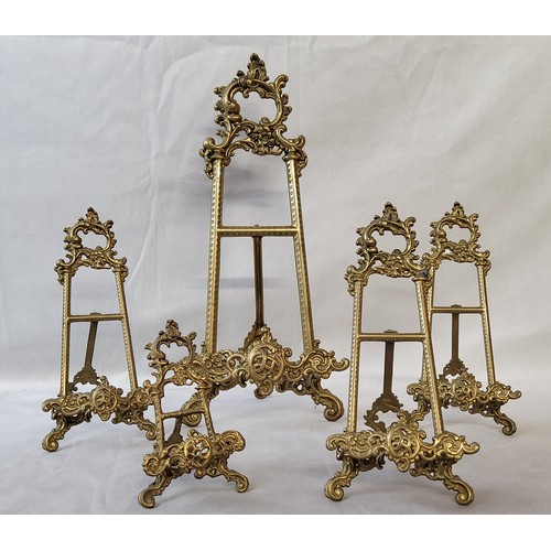 18 - Five decorative Roccoco type brass table easels, various sizes, the largest measures 40cm high