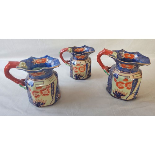 40 - A set of three 19th century Victoria Ironstone jugs,  in the imari pallette, Oriental inspired.... 