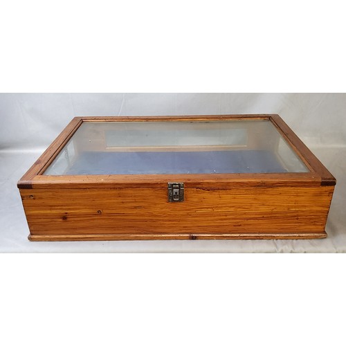 142 - A large 20th century stained pine table top bijouterie cabinet, glass complete. 74cm wide x 52c... 