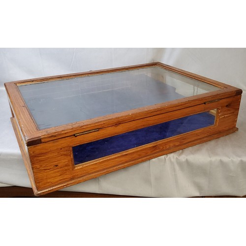 142 - A large 20th century stained pine table top bijouterie cabinet, glass complete. 74cm wide x 52c... 