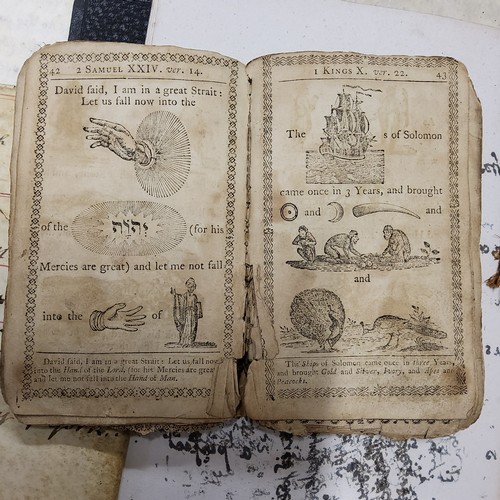 143 - A late 17th / early 18th century pictorial religious book, showing pictorial illustration representa... 