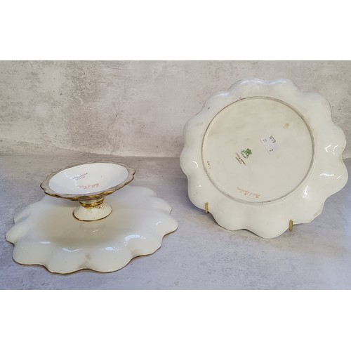 7 - An Aynsley porcelain scallop edged tazza, painted with a view of and titled 'The Castle of Chillon' ... 