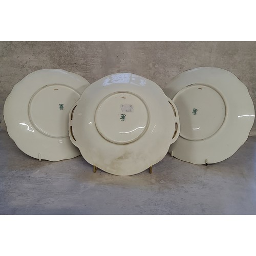 15 - Three Coalport cabinet plates by Fred Howard, painted with panels of cabbage roses set against mossy... 
