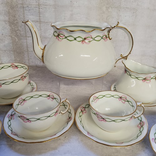 19 - A 1920's Royal Crown Derby part tea service for four, handpainted&nbsp; with a green ribbon & pi... 