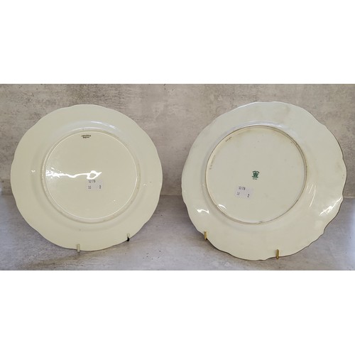 22 - A Coalport wavy edge cabinet plate, titled 'In The Highlands' painted by Percy Simpson, signed, with... 