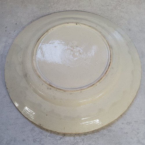 23 - An 18th century Staffordshire creamware plate handpainted with a blue border to rim, birds in flight... 