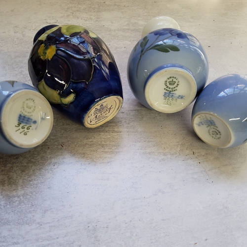 29 - Decorative Ceramics- a Moorcroft miniature ovoid vase, Clematis pattern on deep blue ground, Walter ... 