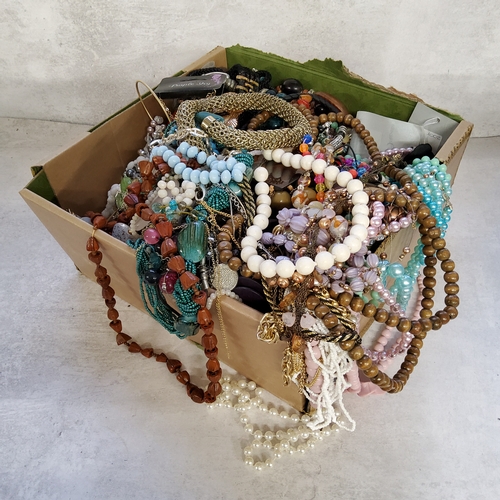 243 - A large collection of costume Jewellery, including beads, brooches, bangles, necklaces etc qty
