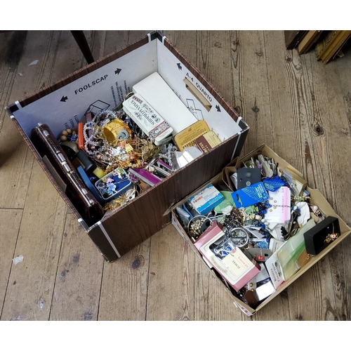 244 - A vast quantity of costume jewellery in two boxes