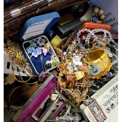 244 - A vast quantity of costume jewellery in two boxes