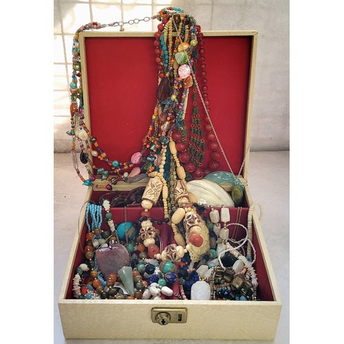 245 - A vintage jewellery box containing various necklaces including a carved alabaster necklace with an a... 