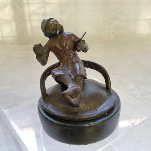 68 - A novelty cold painted bronze paperweight of a seated anthropomorphic monkey in a smoking jacket &am... 
