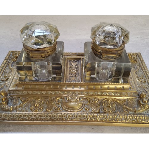 8 - A late 19th century desk top two ink bottle and pen stand deocrated in relief swags & flowers, a... 