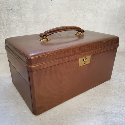 239 - A Morrocan brown leather travel jewellery case, suede lined, fitted interior