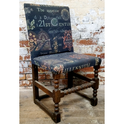 379 - An 18th century jointed English oak hall chair with modern tapestry upholstery c.1760