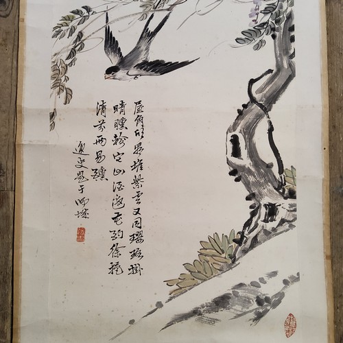 5 - An early 20th century Chinese hanging calligraphy scroll, Qing dynasty,
painted with swallows and Wi... 