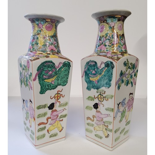 8 - A pair of early 20th century Chinese porcelain Famille Rose vases of tapering square sectional form,... 