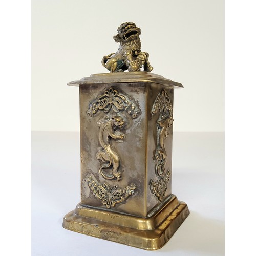 9 - An interesting Oriental canister surmounted with Dog of Foo handle, the rectangular body decorated i... 