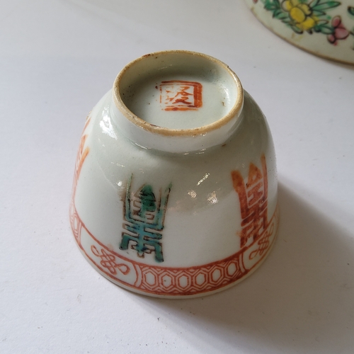 15 - A Chinese Cantonese cylindrical teapot and cover and a pair of tea bowls, typically painted with peo... 