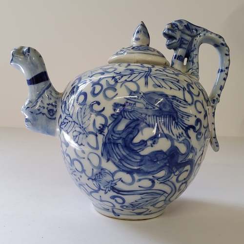 16 - Oriental Ceramics - a Qing underglaze blue and white teapot decorated with dragon, six character mar... 