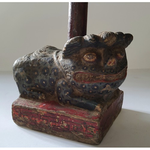 30 - An early Chinese polychrome painted carved stone temple guardian, well carved, showing signs of age.