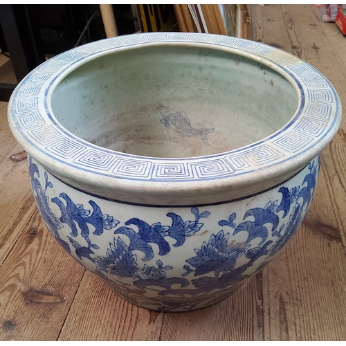 42 - A Chinese underglazed blue and white planter / jardiniere, four character maks for base, goldfish to... 